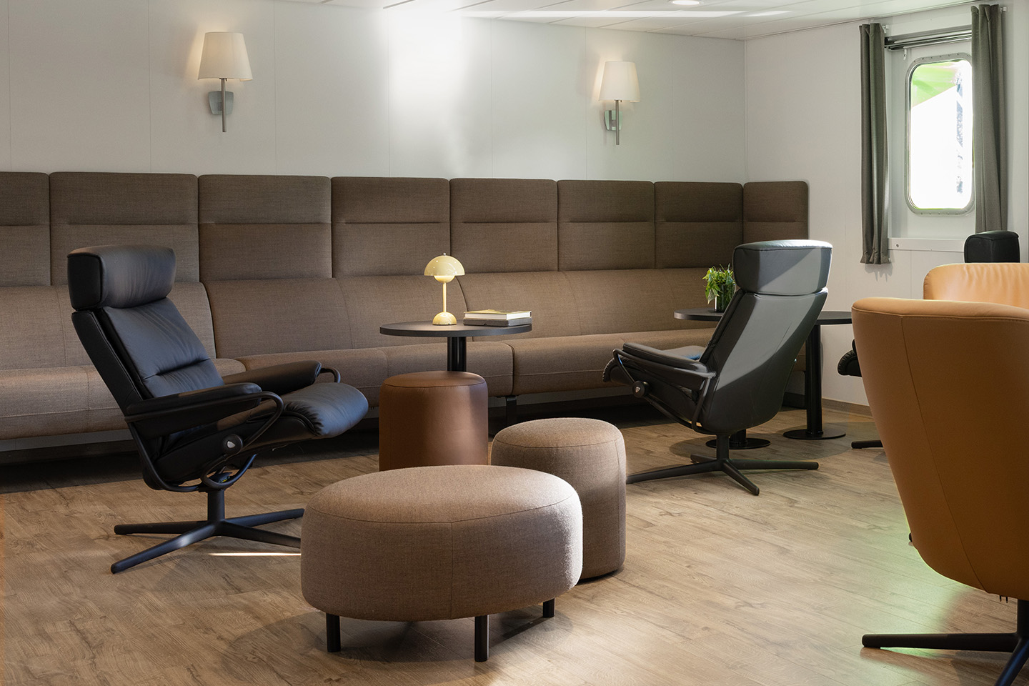 Lounge area onboard a Vard vessel filled with Stressless furniture